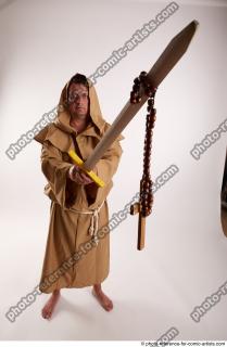 JOEL_ADAMSON STANDING POSE WITH SWORD AND CRUCIFIX
